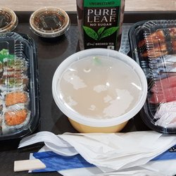 U2 JAPAN - No seating at sushi bar. Disposable dishes and flatware. No sake or hot drinks. Soy- 1oz solo cups. And the cafeteria tray. 2022 06 04.