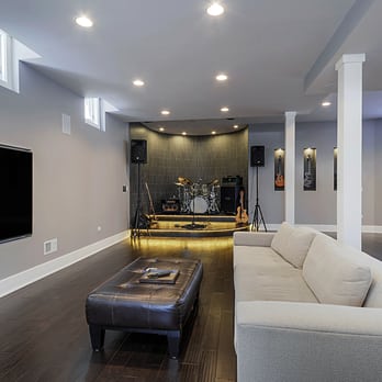 Sebring Design Build - A modern basement finishing project with a built in stage for playing music. - General Contractors Near Me - Naperville, Illinois Sebring Design Build - A modern basement finishing project with a built in stage for playing music. - General Contractors Near Me - Naperville, Illinois
