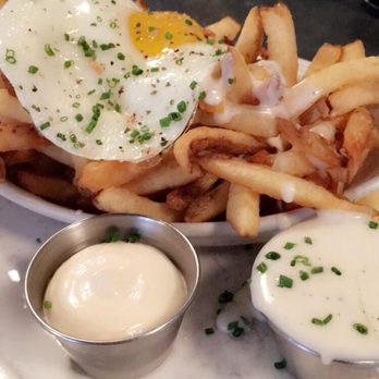 Au Cheval - Fries with mornay sauce, garlic aioli, and fried egg - Bars Near Me - Chicago, Illinois Au Cheval - Fries with mornay sauce, garlic aioli, and fried egg - Bars Near Me - Chicago, Illinois