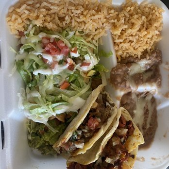 Casa Taquito - Taquitos plate, with lettuce, sour cream, and guac on top. Two tacos on the side. - Mexican Near Me - Corona, California