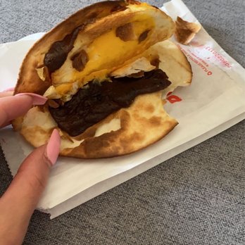 Dunkin' - This is supposed to be a wake up wrap the cheese is the black part... - Donuts Near Me - Sumter, South Carolina