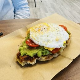 Avocado toast on a waffle with an egg Avocado toast on a waffle with an egg