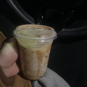 Starbucks - a person holding a cup of coffee - Coffee & Tea Near Me - Garfield Heights, Ohio Starbucks - a person holding a cup of coffee - Coffee & Tea Near Me - Garfield Heights, Ohio