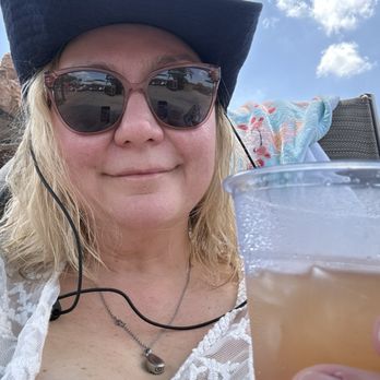 My Happy Place Destinations - Mommy enjoying an adult beverage at the pool - Travel Agents Near Me