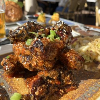 Reunion Kitchen + Drink - Tasty, crispy Asian ribs with a Thai peanut slaw. - New American Near Me - Santa Barbara, California