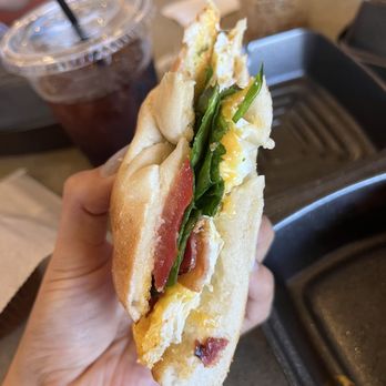 Austin Grind - Egg & Cheddar Bagel with bacon, spinach, and tomato - Coffee & Tea Near Me - Austin, Texas