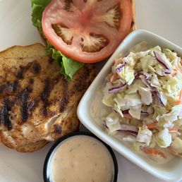 Blackened red snapper sandwich with Cole slaw and spicy chili sauce Blackened red snapper sandwich with Cole slaw and spicy chili sauce