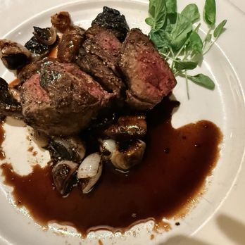 The Capital Grille - Sliced Stea Sliced Filet Mignon with Cipollini Onions, Wild Mushrooms and Fig Essence - Steakhouses Near Me - Troy, Michigan The Capital Grille - Sliced Stea Sliced Filet Mignon with Cipollini Onions, Wild Mushrooms and Fig Essence - Steakhouses Near Me - Troy, Michigan