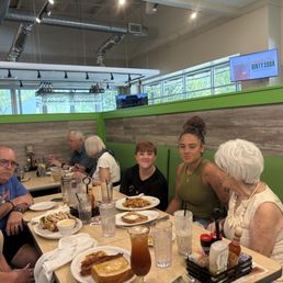 Family members enjoying their lunch. Family members enjoying their lunch.