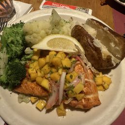 Grilled salmon dusted with old bay, steamed vegetables and baked potato. Grilled salmon dusted with old bay, steamed vegetables and baked potato.