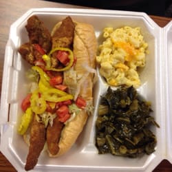 Catering By George - Fish sub with peppers and tomatoes. Mac and cheese with greens