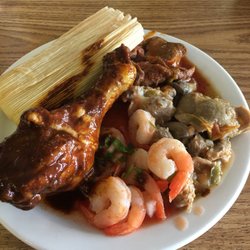 Cielito Lindo - From top: tamale with nopales, carne de res (beef), chicken gizzards, shrimp cocktail, chicken mole.