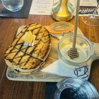Enoteca Italia - Focaccia bread with honeycomb - Italian Near Me - Dallas, Texas Enoteca Italia - Focaccia bread with honeycomb - Italian Near Me - Dallas, Texas