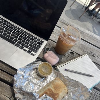Huckleberry Roasters - Working outside with a breakfast burrito and a cold brew coffee - Coffee Roasteries Near Me - Denver, Colorado