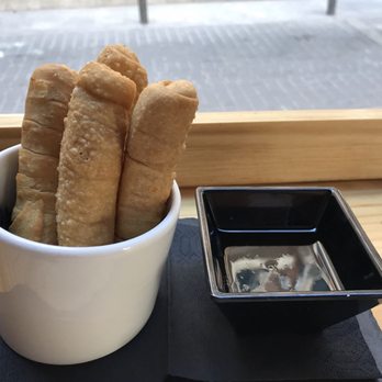 Cacao Restobar - Tequenos (filled with cheese) with papelon sauce (caramelized dark sugar) - Mediterranean Near Me - Madrid, M