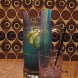 a pitcher of lemonade and a glass of water