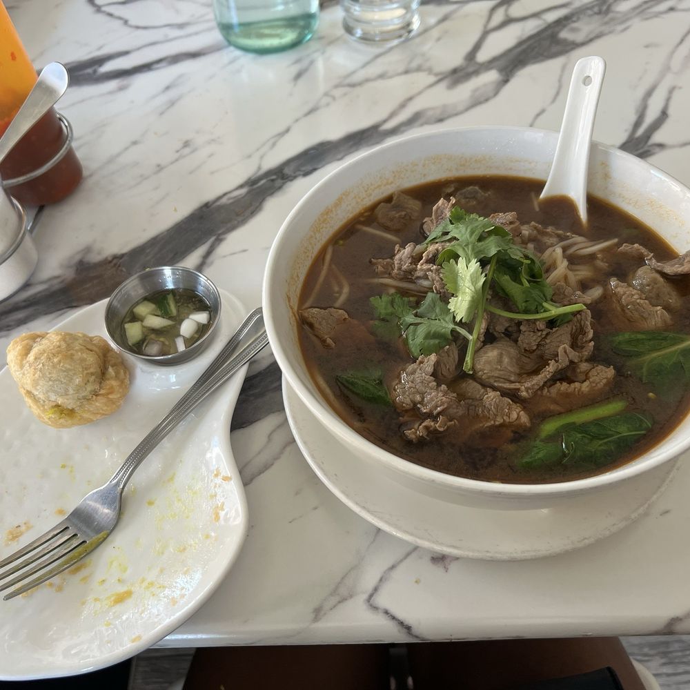 Tasty Thai - 1 out if the 3 delicious Curry Puffs on the left, On the right is the flavorful Beef Noodles Soup. - Thai Near Me - New York, New York