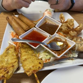 Sab Fried Rice - Sampler: Egg rolls, spring rolls, cream cheese wontons, dumplings, and chicken satay. - Thai Near Me - Fort Smith, Arkansas Sab Fried Rice - Sampler: Egg rolls, spring rolls, cream cheese wontons, dumplings, and chicken satay. - Thai Near Me - Fort Smith, Arkansas