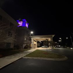 Sleep Inn & Suites - Hotel at night.