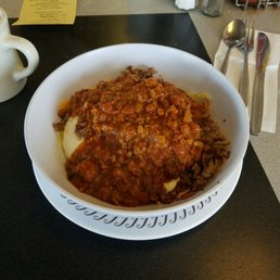 The amazing hash Brown bowl with 4 over easy eggs and chili. The amazing hash Brown bowl with 4 over easy eggs and chili.