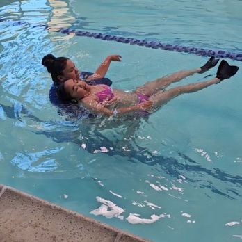 Safe Swim Academy - Gracelyn and Ms. Sabrina teaching Gracelyn how to swim on her back. - Swimming Lessons/Schools Near Me Safe Swim Academy - Gracelyn and Ms. Sabrina teaching Gracelyn how to swim on her back. - Swimming Lessons/Schools Near Me