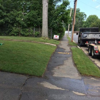 Albertos Landscape - a truck parked on the side of the road - Landscaping Near Me - Waltham, Massachusetts