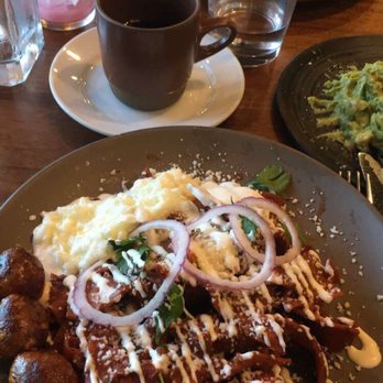 Madre - Chilaquiles with egg whites and chorizo accompanied by café de olla. - Mexican Near Me - Torrance, California