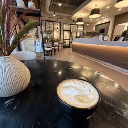 Papaver Roaster House - Cappuccino on black table.
