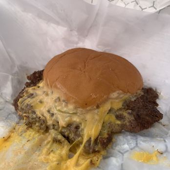 Cheesesteak & Co - Close-up of smash burger with cheese - Fast Food Near Me - Elkridge, Maryland