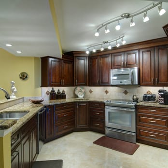 Island Kitchen & Bath Construction - a kitchen with stainless steel appliances - General Contractors Near Me - Jensen Beach, Florida