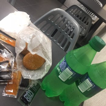 Lius Kitchen - a plastic chair, a plastic bottle of soda, and a bag of donuts - Seafood Near Me - Dallas, Texas