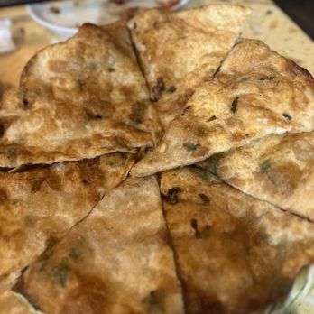 Dumpling House - Green Onion Pancake...a little crunchier than I'm used to, but chewy also, which I liked - Chinese Near Me - Plano, Texas Dumpling House - Green Onion Pancake...a little crunchier than I'm used to, but chewy also, which I liked - Chinese Near Me - Plano, Texas
