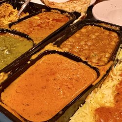 Padmini’s Pizza and Indian Grill - Saag paneer, butter paneer, Chana masala, chicken curry (two Pick 2 curry platters)