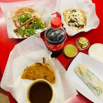 La Divina Tacos - a table with a variety of food items - Mexican Near Me - Buffalo, New York