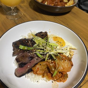 Oak & Reed - Korean Grilled Flat Iron Steak Rice Bowl with kimchi, scallions, and a fried egg - Beer Bar Near Me - Middletown, New York Oak & Reed - Korean Grilled Flat Iron Steak Rice Bowl with kimchi, scallions, and a fried egg - Beer Bar Near Me - Middletown, New York
