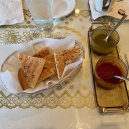 Complementary bread (very fresh!) and spicy chutneys.