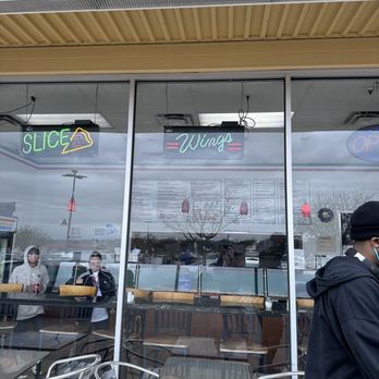 Yaghi's Pizzeria - a man walking past a restaurant - Pizza Near Me - San Antonio, Texas Yaghi's Pizzeria - a man walking past a restaurant - Pizza Near Me - San Antonio, Texas
