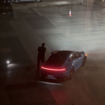 Stanton House - Valet driver propping his phone up and posing with our car - Hotels Near Me - El Paso, Texas