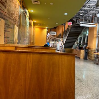 Whole Foods Market - a wooden counter and stairs - Grocery Near Me - Duluth, Georgia Whole Foods Market - a wooden counter and stairs - Grocery Near Me - Duluth, Georgia
