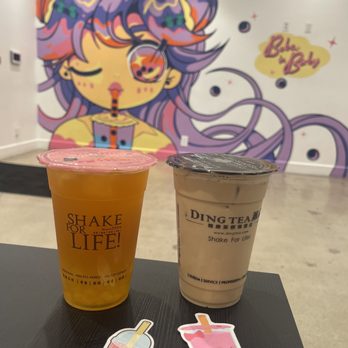 Ding Tea - L2R: Iced Mango Green Tea & Iced Hokkaido Oolong Milk Tea with cute (free) stickers! Awesome mural in the back!  : @ojbaylen - Bubble Tea Near Me - Long Beach, California