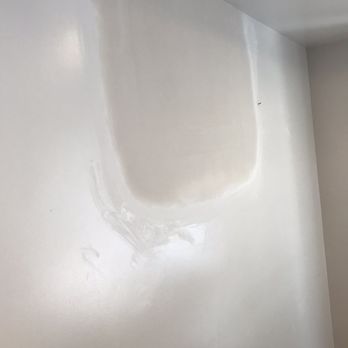 MRG Drywall - After - A wall features a large area of drywall with fresh mud applied, visible sanding marks, and a smooth finish. The patch appears to be part of a drywall repair or installation process, with the surrounding wall painted in a light color. - Drywall Installation & Repair Near Me