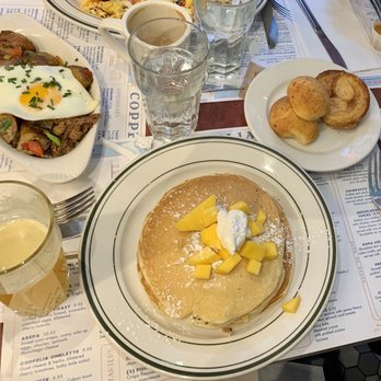 Coppelia - Hash de Costilla and Pancakes with mango, Passionfruit juice, cookies - Cuban Near Me - New York, New York Coppelia - Hash de Costilla and Pancakes with mango, Passionfruit juice, cookies - Cuban Near Me - New York, New York