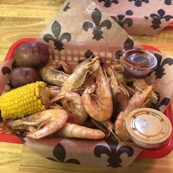 The Crabby Crawfish - Boiled shrimp basket with potatoes and corn