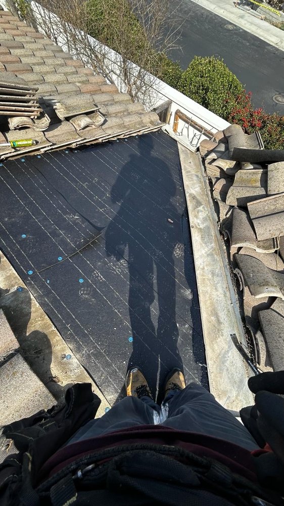 Slide of Spootless Roofing