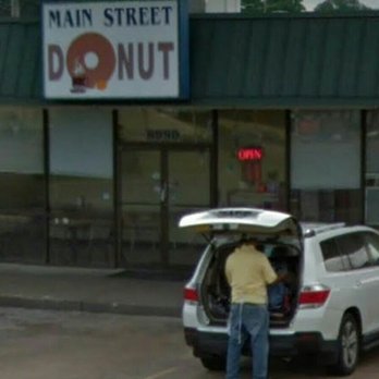 Main Street Donuts - a man opening the trunk of a car - Donuts Near Me - Southhaven, Mississippi Main Street Donuts - a man opening the trunk of a car - Donuts Near Me - Southhaven, Mississippi