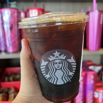 Starbucks - a hand holding a cup of coffee - Coffee & Tea Near Me - Honolulu, Hawaii Starbucks - a hand holding a cup of coffee - Coffee & Tea Near Me - Honolulu, Hawaii
