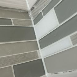 Lux Construction - The accent tile should have been flush with the other tile. This will be a breeding ground for water and mold.