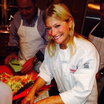 Dazzle Me A Dish - Chef Cynthia at work during a Couples Cooking Class!  Cheers! - Party & Event Planning Near Me