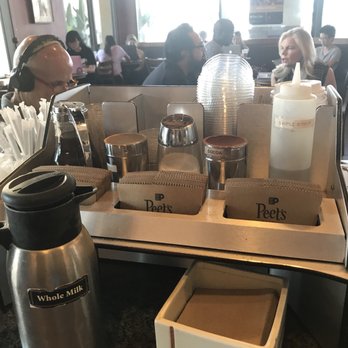 Peet's Coffee - Additional ingredients station along with background of productive yet slightly noisy environment - Coffee & Tea Near Me - Irvine, California