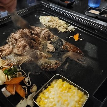 Miss Gogi - a grill with meat and vegetables on it - Korean Near Me - McDonough, Georgia Miss Gogi - a grill with meat and vegetables on it - Korean Near Me - McDonough, Georgia